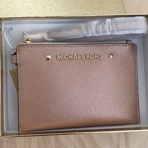 Micheal Kors Rose gold Wristlet wallet/ card